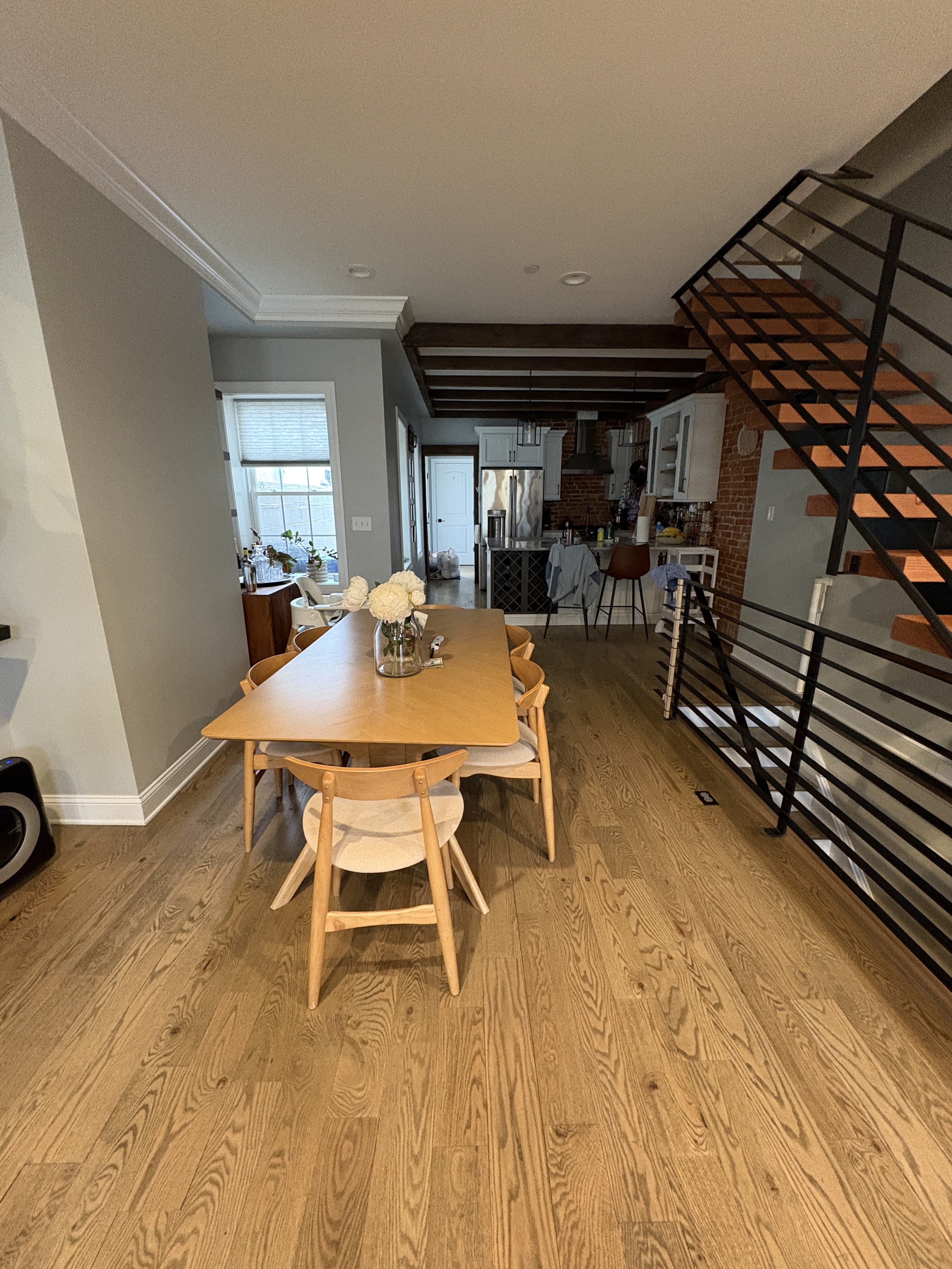 Dining area with modern floating staircase